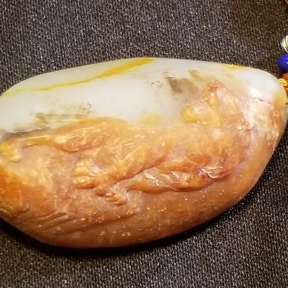 Hand carved imported jade tiger pendant
